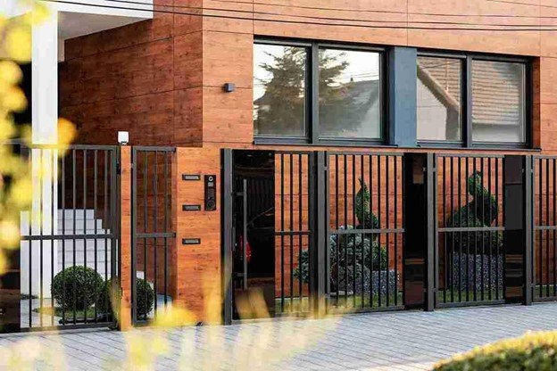 Custom metal entry gate installed at a residential property, combining security with modern architectural design.